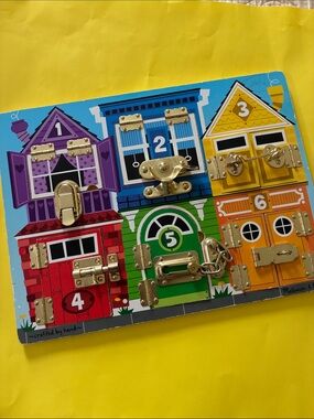 Melissa & Doug Latches Board (like new)